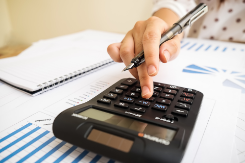 accountant using a calculator