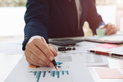 accountant with worksheets